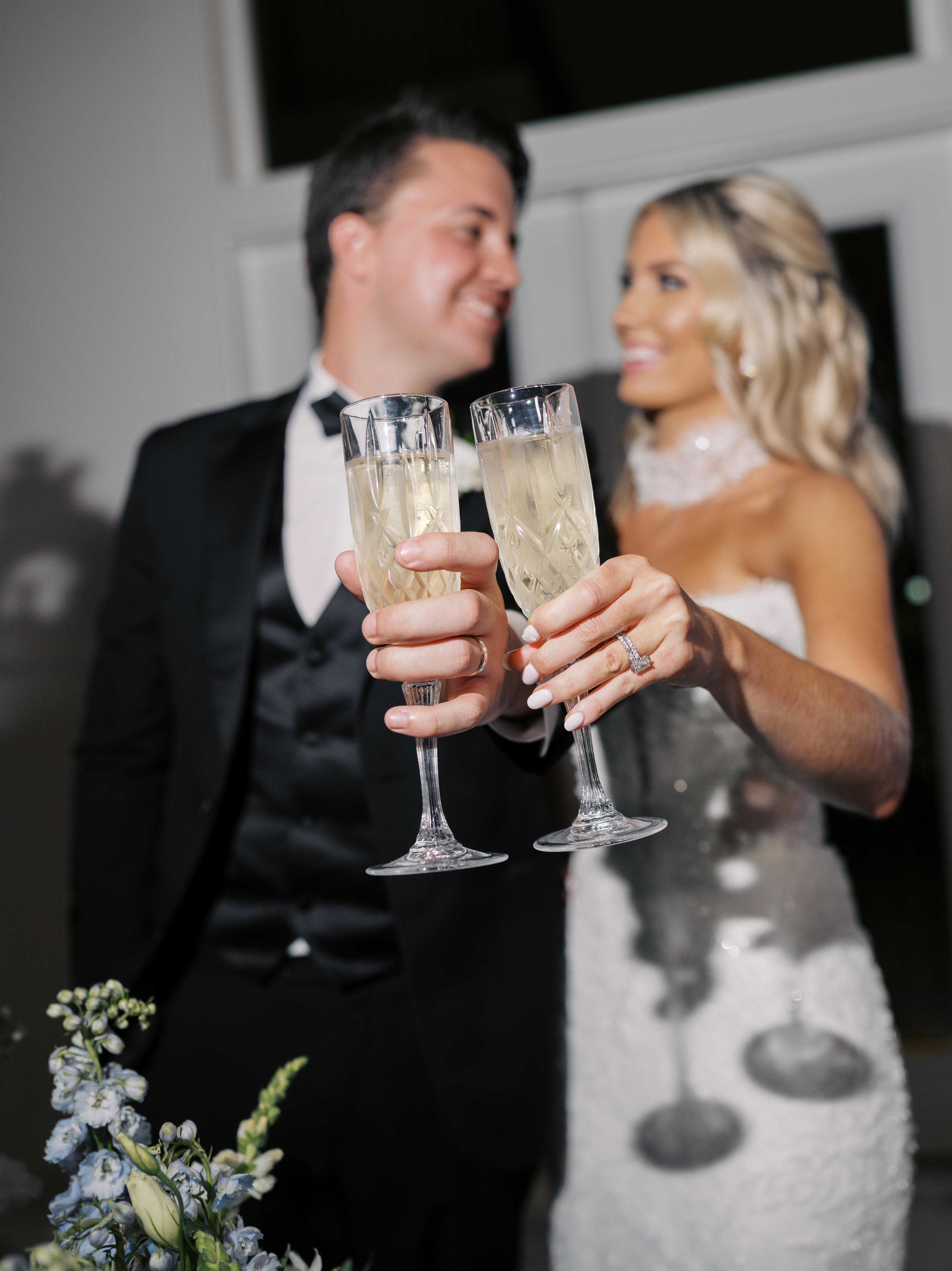 Bride and groom toasting with champagne